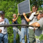 Collecting water monitoring data with data loggers. Photo by Evergreen Conservancy