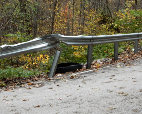 Figure 6. The same sharp turn from Figure 1. on Barker Run Road, taken Oct. 2014. The guardrail is damaged but still useful.