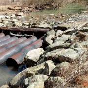 Near Dry Ridge, API 47-103-02433. All of the water is flowing around the pipes.