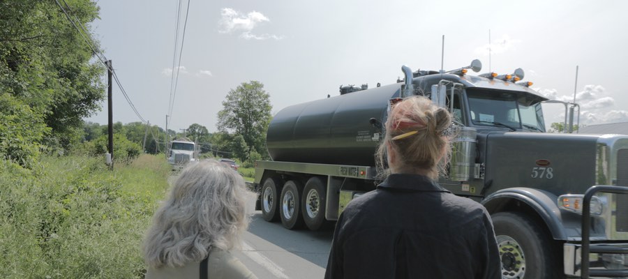 Volunteers counting trucks supplying a new well pad in PA