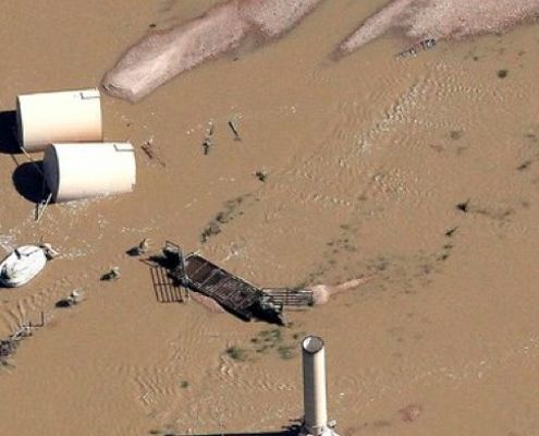 Flooded well and toppled oil storage tanks in Weld County, Colorado 2013. Rick Wilking/Reuters