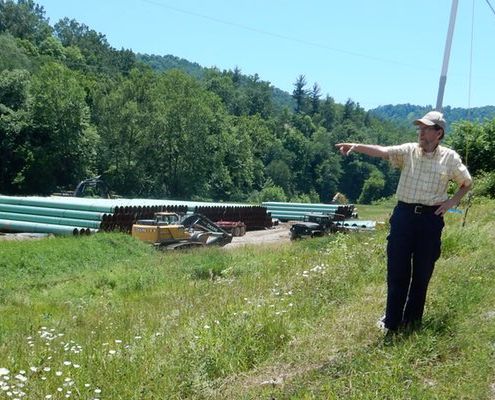 Bill Hughes giving tour to students in shale fields, WV