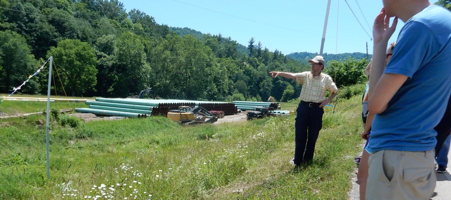 Bill Hughes giving tour to students in shale fields, WV