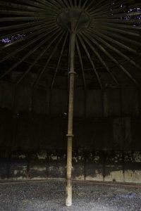 Inside an oil holding tank that dates back to the 1980’s North Dakota boom. You can see the corrosion that has worn down the steel structure over the years. Keene, North Dakota. Photo by David Nix 2015