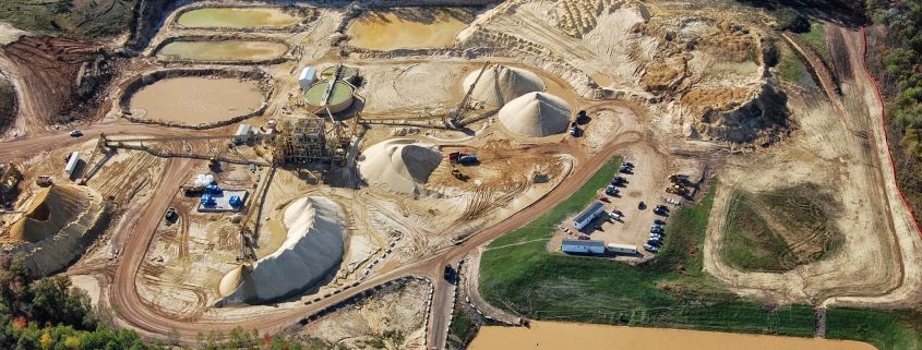 Western Wisconsin frac sand mine overburden, water impoundments, and processing infrastructure.