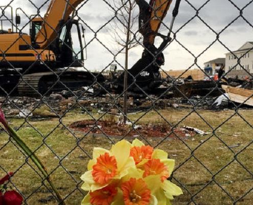 Heavy equipment moves debris from the site of a house explosion April 17 in Firestone, Colo., which killed two people. (David Kelly / For The Times)