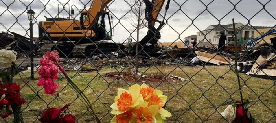 Heavy equipment moves debris from the site of a house explosion April 17 in Firestone, Colo., which killed two people. (David Kelly / For The Times)