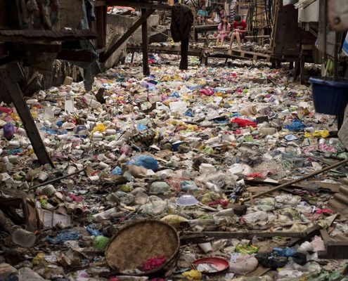 Photo of garbage filled creek in the Philippines