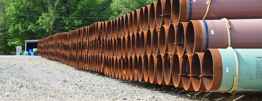 Stacked pipes used in constructing oil and gas pipelines