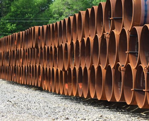 Stacked pipes used in constructing oil and gas pipelines